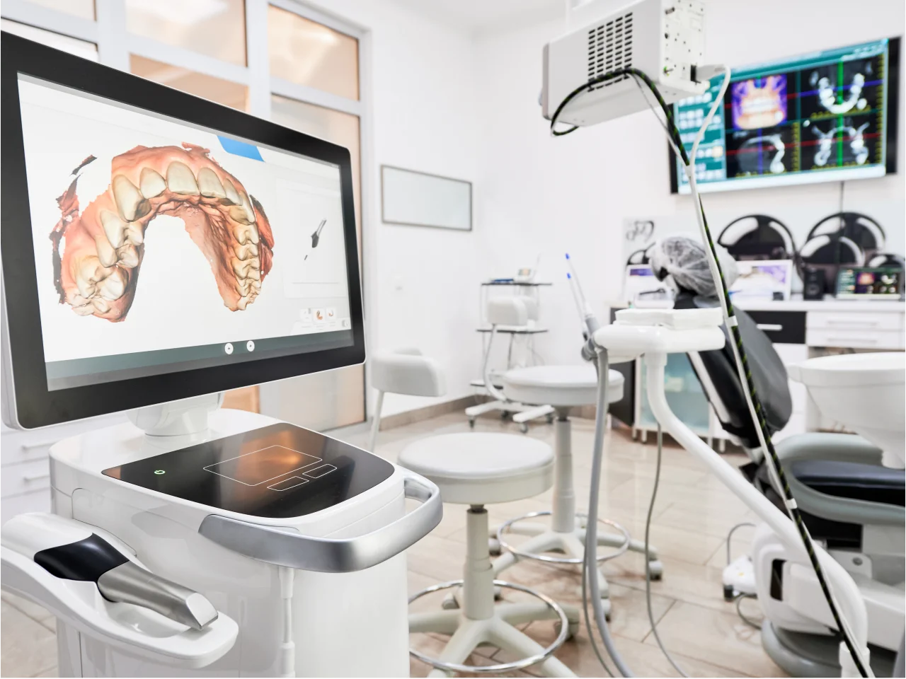 Modern dental operatory with advanced digital equipment and treatment chair