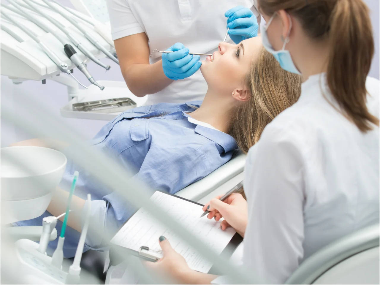 Patient relaxing comfortably in dental chair during sedation dentistry procedure"