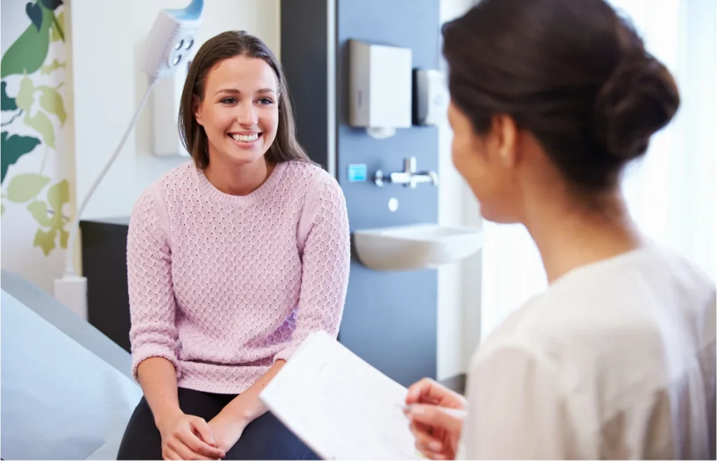 Woman in consultation with dentist discussing treatment plan in dental office